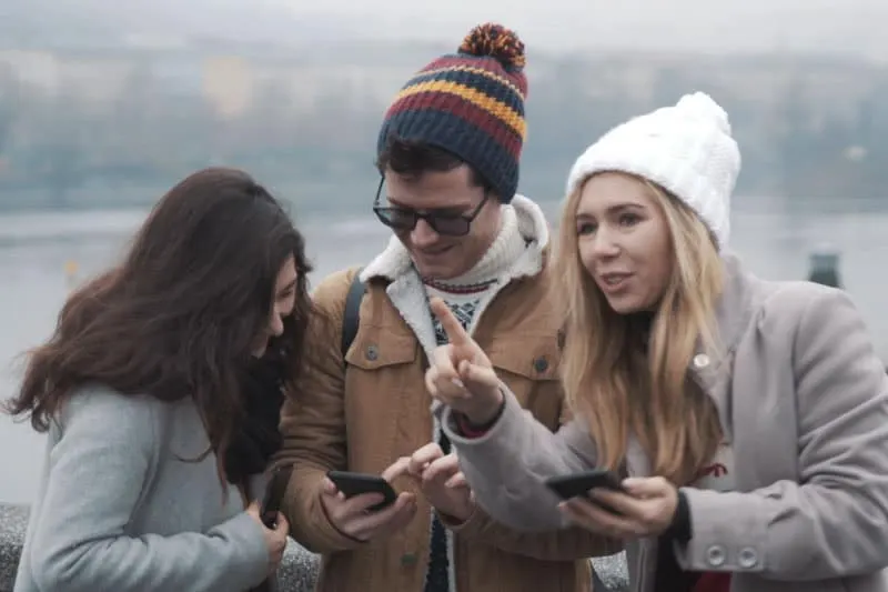 group having fun in autumn with gps games